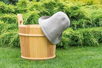 Image showing Wooden bucket and felt hat for the sauna.