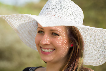 Image showing cheerful fashionable woman with hat