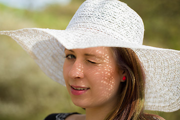 Image showing cheerful fashionable woman with hat