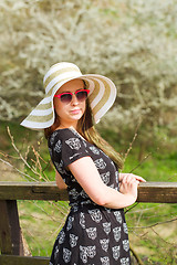 Image showing cheerful fashionable woman with hat