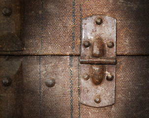 Image showing Old canvas trunk hinge close up