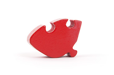 Image showing Closeup of big red jigsaw puzzle piece