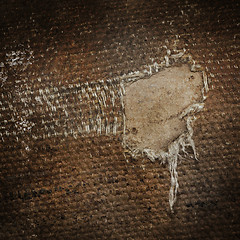 Image showing Detail (damage) of an old canvas suitcase, close-up