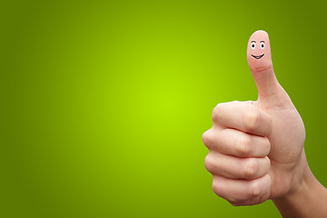 Image showing Happy cheerful smiley finger on green background