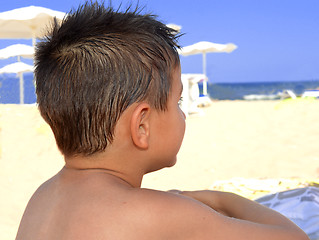 Image showing Kid contemplate the sea