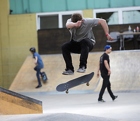 Image showing Male skater jumping high in the air