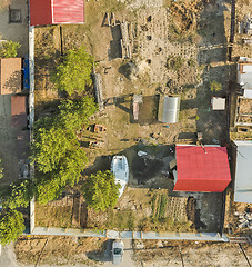 Image showing Aerial view on ground plot with cottage. Russia