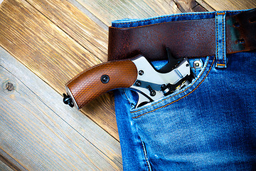 Image showing silver revolver in the pocket