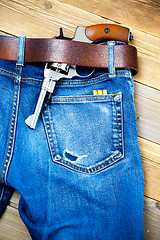 Image showing revolver under a leather belt