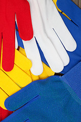 Image showing colored work gloves on the display