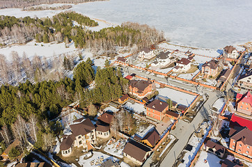 Image showing Aerial view on suburban street near lake at spring