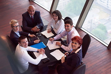 Image showing business people group on meeting at modern bright office