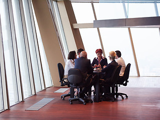 Image showing business people group on meeting at modern bright office