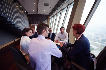 Image showing business people group on meeting at modern bright office