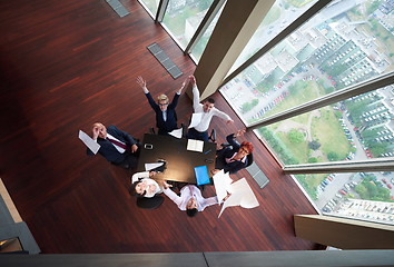 Image showing top view of business people group throwing dociments in air