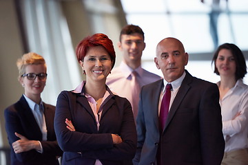 Image showing diverse business people group with redhair  woman in front