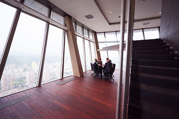 Image showing business people group on meeting at modern bright office