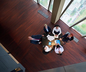 Image showing top view of business people group throwing dociments in air