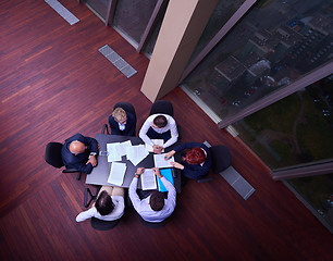 Image showing top view of business people group throwing dociments in air