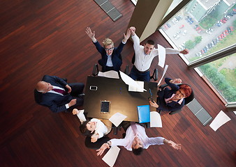 Image showing top view of business people group throwing dociments in air