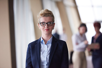 Image showing business people group, woman in front  as team leader