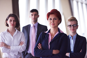 Image showing diverse business people group with redhair  woman in front