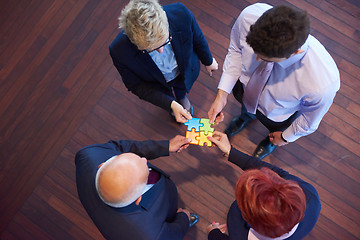 Image showing assembling jigsaw puzzle