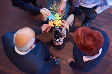 Image showing assembling jigsaw puzzle