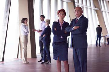 Image showing diverse business people group with redhair  woman in front