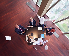 Image showing top view of business people group throwing dociments in air