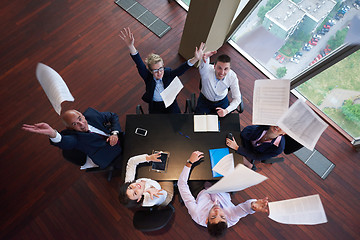 Image showing top view of business people group throwing dociments in air