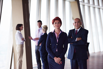 Image showing diverse business people group with redhair  woman in front