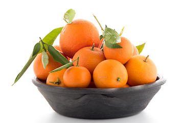 Image showing Tangerines on clay bowl 