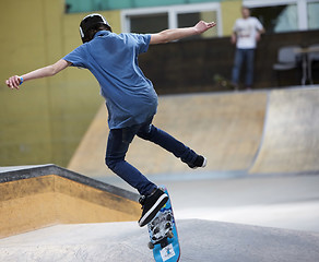 Image showing Male skater jumping high in the air