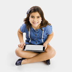 Image showing Young girl using a tablet