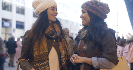 Image showing Two women chatting at a street in winter