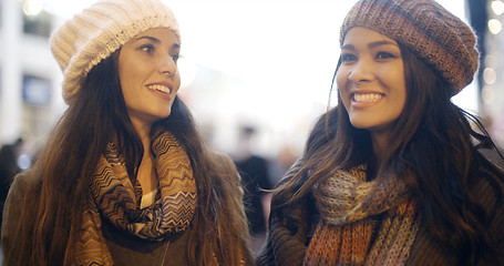 Image showing Two young woman enjoying a winter night out