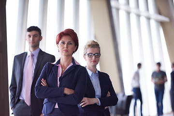 Image showing diverse business people group with redhair  woman in front