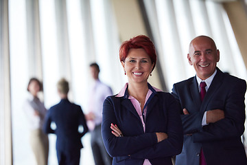 Image showing diverse business people group with redhair  woman in front