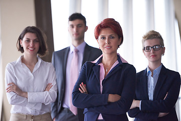 Image showing diverse business people group with redhair  woman in front