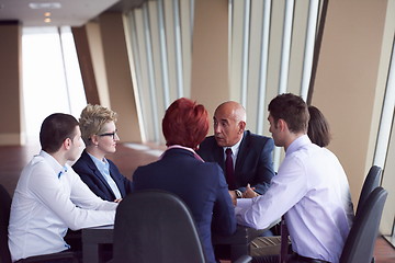 Image showing business people group on meeting at modern bright office