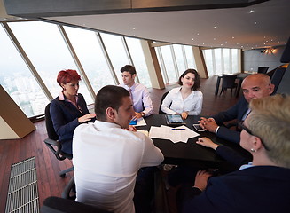 Image showing business people group on meeting at modern bright office