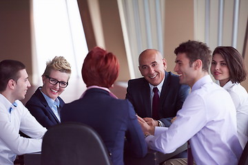 Image showing business people group on meeting at modern bright office