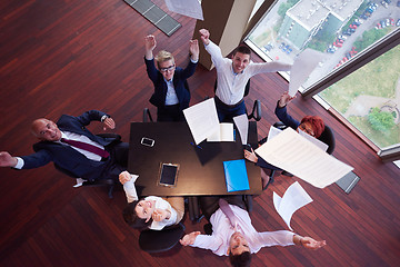 Image showing top view of business people group throwing dociments in air