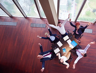 Image showing top view of business people group throwing dociments in air