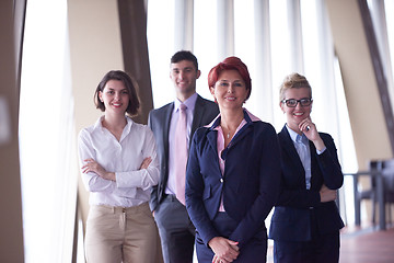 Image showing diverse business people group with redhair  woman in front