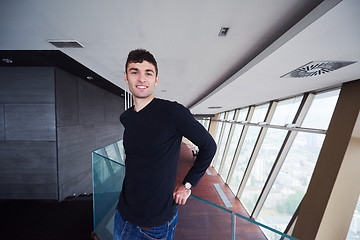 Image showing young successful man in penthouse apartment