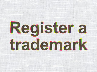 Image showing Law concept: Register A Trademark on fabric texture background