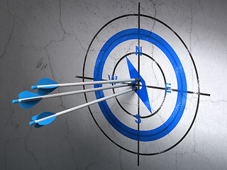 Image showing Vacation concept: arrows in Compass target on wall background