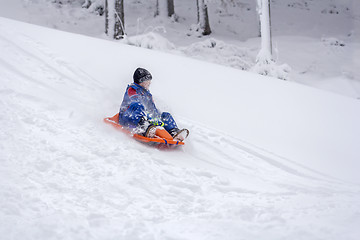 Image showing Child sledding